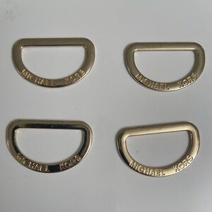 Michael Kors Gold Tone sleeve tabs